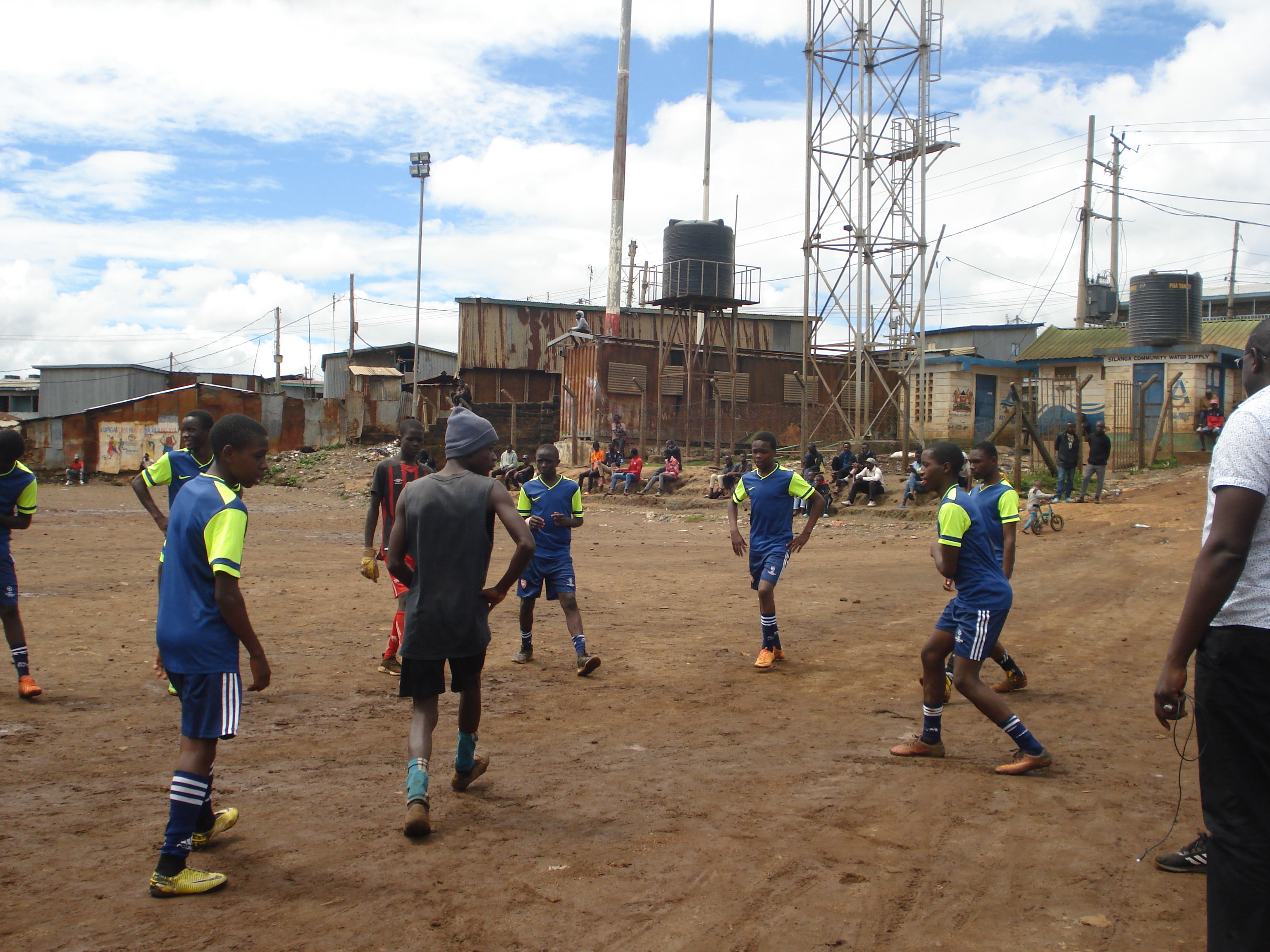 Youths playing
                         football in Kibra, Nairobi.