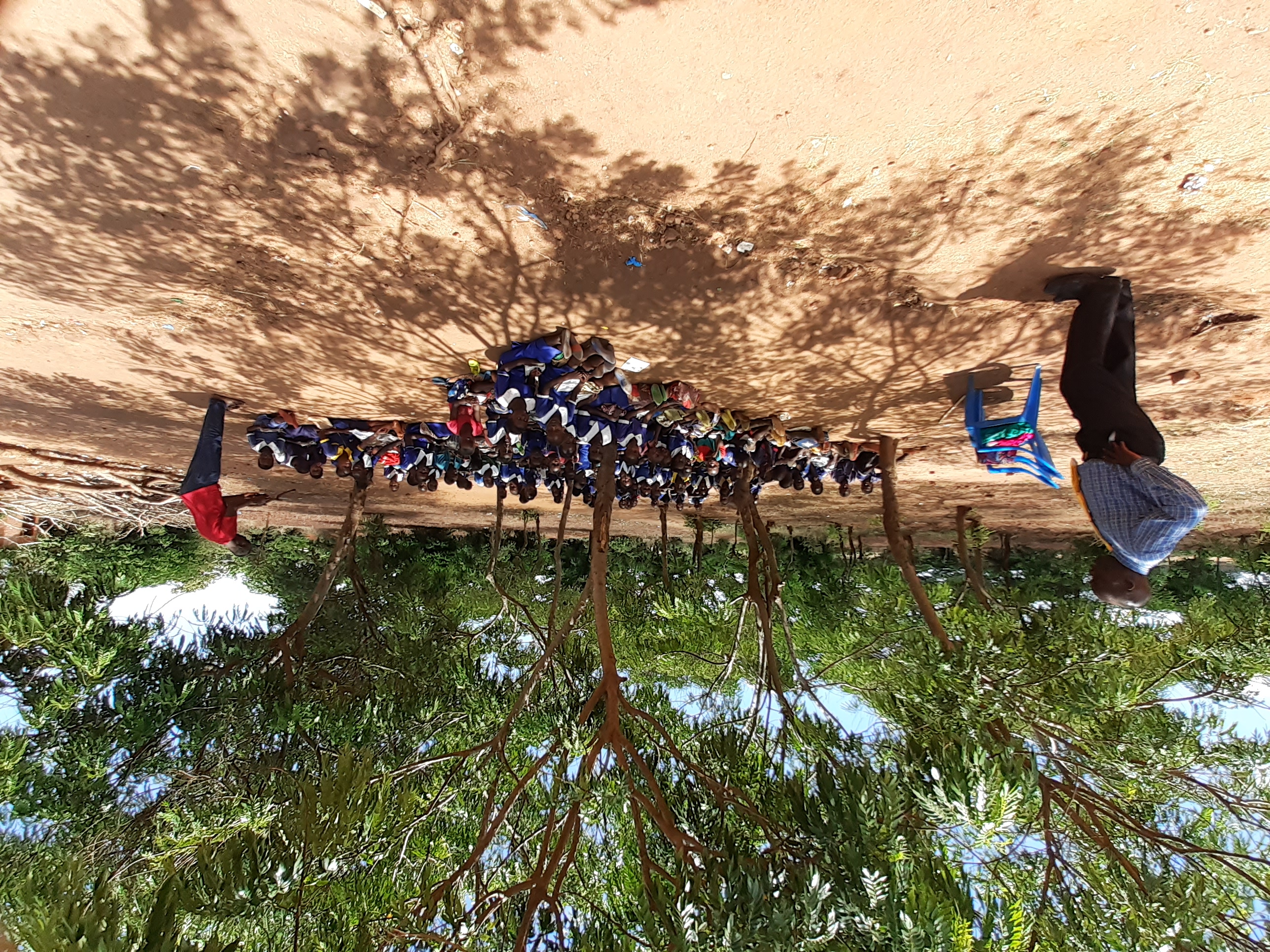 Students being
                    taught outside at Mteza LEA school, Mteza village, Malawi.